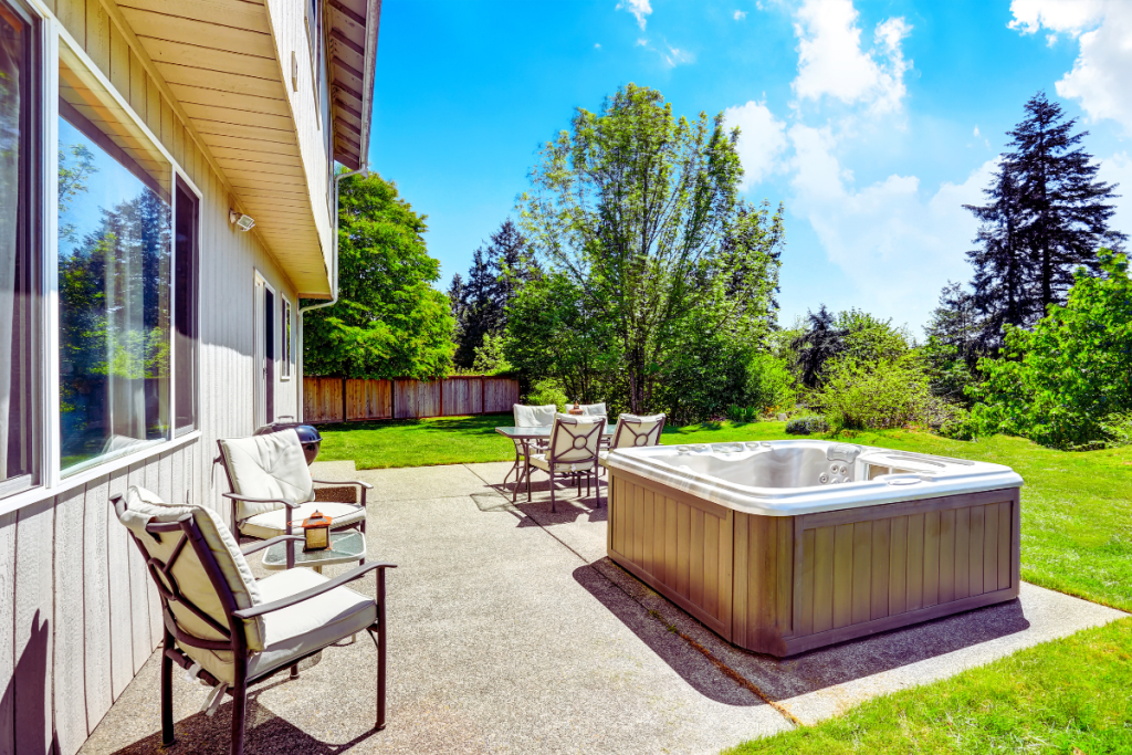 concrete patio with hot tub and chairs restored by concrete contractors Minneapolis